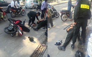 Xôn xao hình ảnh 1 cảnh sát cơ động bị xô ngã sõng soài ở Hà Nội
