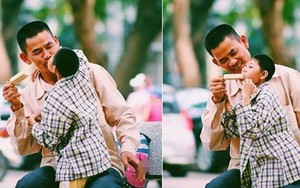 Đằng sau bức ảnh em bé khuyết tật hôn cha nghèo giữa phố Hà Nội