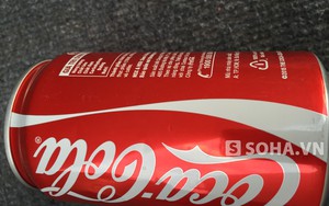 Lon Coca-Cola chưa bật nắp nhưng không hề có nước bên trong