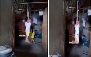 Xác minh đoạn video bé gái bị cột tay treo trên xà nhà