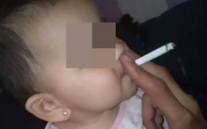 Bố thản nhiên tiếp tay cho con gái nhỏ hút thuốc khiến cộng đồng mạng phẫn nộ