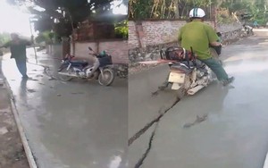 Bị ngăn cản lao vào đường đang đổ bê tông, người đàn ông đòi đánh công an