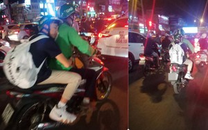 Thanh niên ngủ trên lưng nam tài xế Grab Bike khiến bao người đi đường tò mò, chụp ảnh