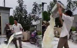 Clip xôn xao: Người đàn ông giận dữ đổ từng thùng sữa xuống đường vì cho rằng cửa hàng thu mua ép giá