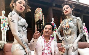 Hình ảnh Quang Tèo ngồi giữa 2 người mẫu body painting gây tranh cãi