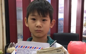 Cậu bé 8 tuổi đập lợn tiết kiệm lấy 220.000 đồng đội mưa đi ủng hộ chống dịch Covid-19