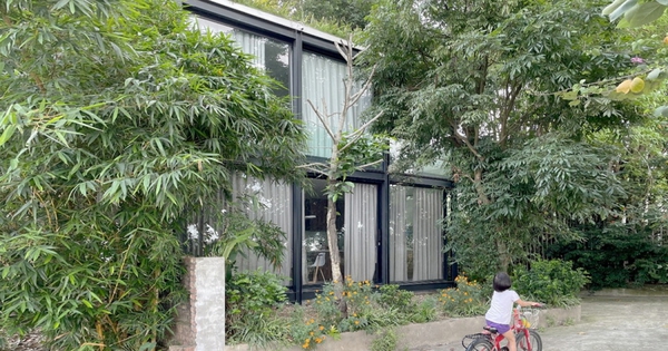 Small transparent house by the river