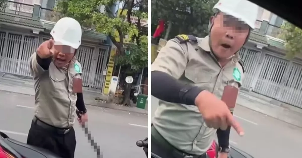 Hai người mặc đồ bảo vệ, cầm hung khí đe dọa tài xế tại TPHCM