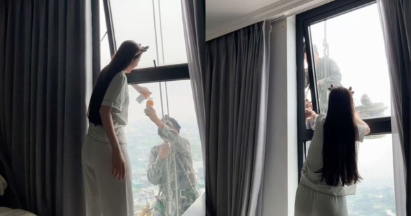 Mát lòng cảnh cô gái mời nước anh thợ treo mình giữa trời nóng lau kính cao ốc