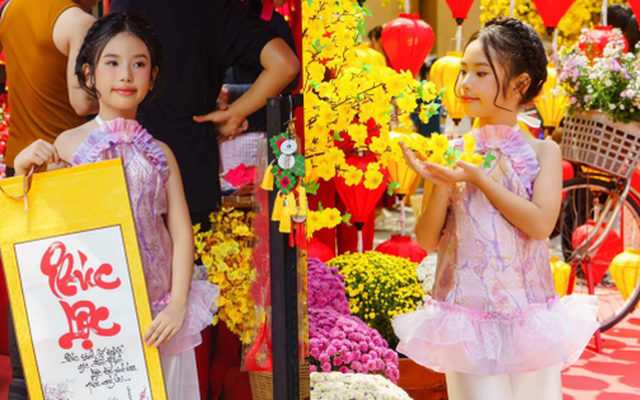 Mẫu nhí Nguyễn Ngọc Bảo Hân diện áo yếm xuống phố đón xuân, xin chữ