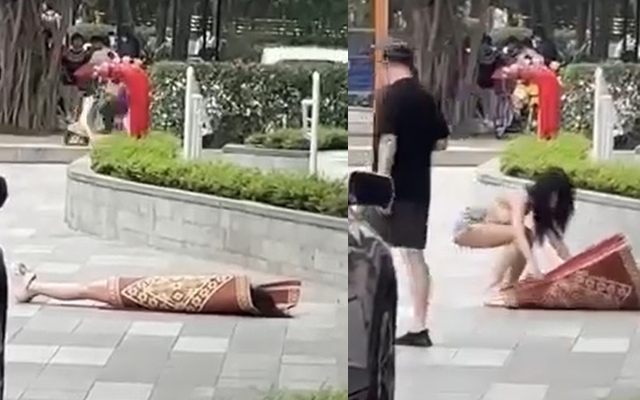 Clip hot girl có hành động khó hiểu, nằm đắp chiếu giữa sảnh chung cư đông người