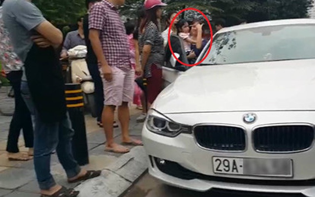 Bố dùng búa đập vỡ kính xe BMW để giải cứu con gái