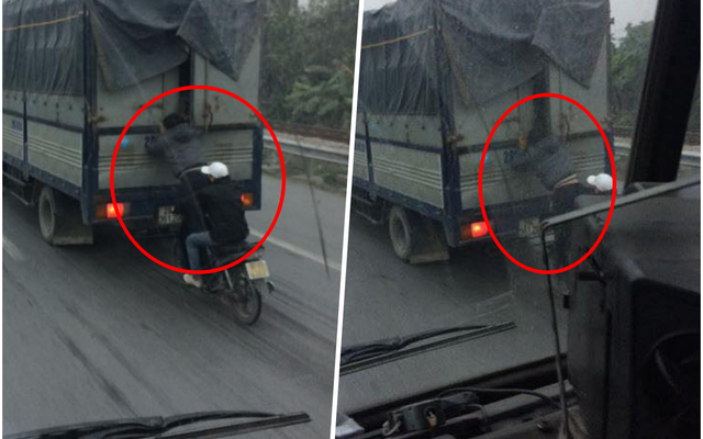 Hình ảnh nam thanh niên đứng trên xe máy, đu bám xe tải đầy nguy hiểm