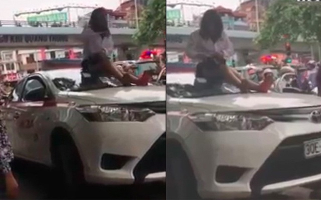 Vượt đèn đỏ, nữ tài xế taxi trèo lên nóc xe lăng mạ, 'ăn vạ' CSGT